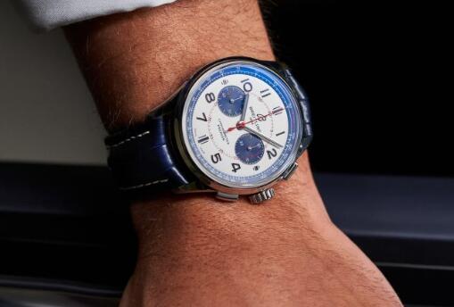 The blue and red elements on the silver dial are striking.